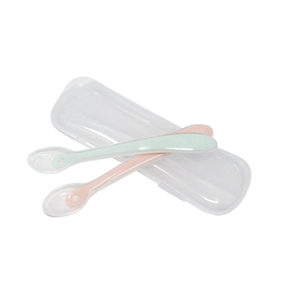 Mint and pink baby feeding spoons with a clear travel case by Mama's Dream