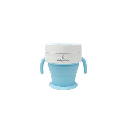 Blue Baby's Brew baby cup with two handles and lid on a white background by Mama's Dream