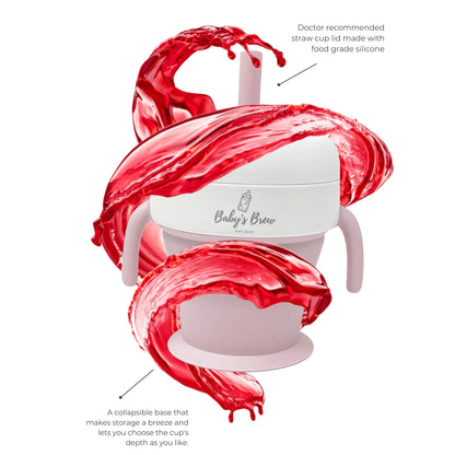 Pink Baby's Brew straw cup with two handles and a collapsible base by Mama's Dream