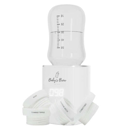 Baby's Brew portable bottle warmer with measuring container and bottle adapters on a white background by Mama's Dream
