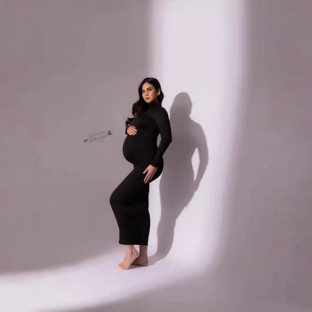 Black long sleeve maternity photoshoot dress with turtleneck and fitted silhouette by Mama's Dream