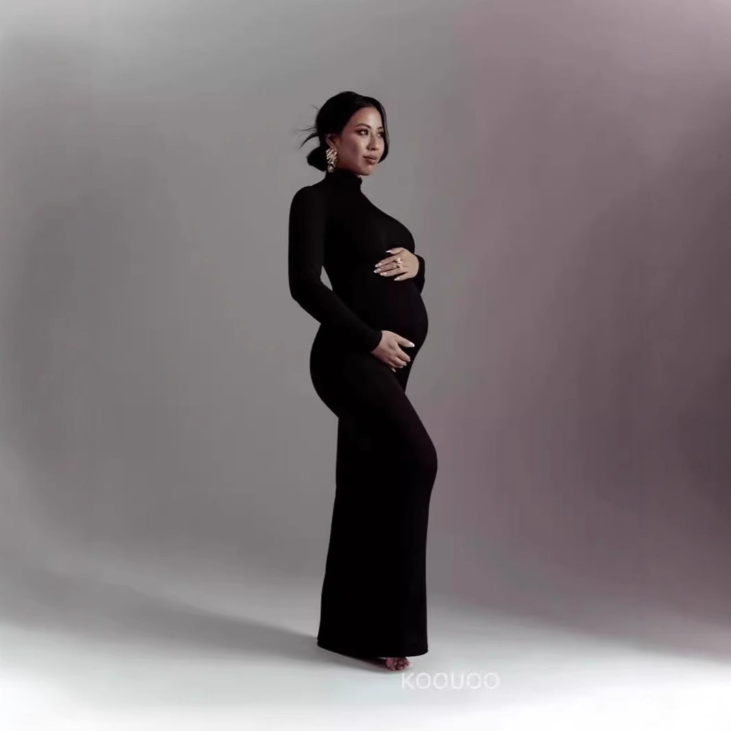 Black long sleeve maternity gown with turtleneck and fitted floor length silhouette for pregnancy photoshoots by Mama's Dream