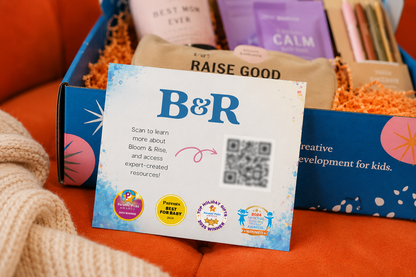 Bloom & Rise resource card with QR code displayed in an open gift box by Mama's Dream