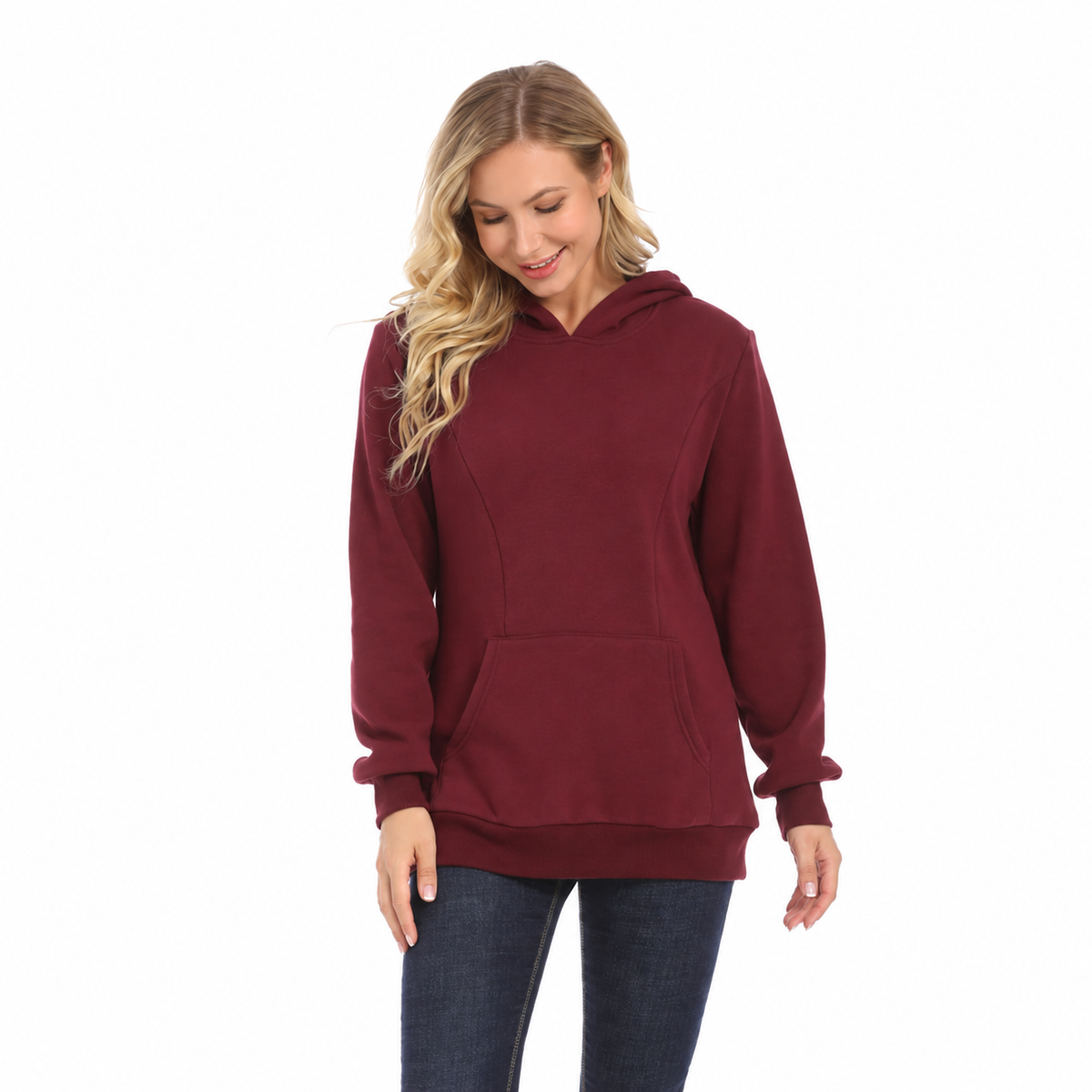 Woman wearing a burgundy maternity nursing hoodie with long sleeves and a front kangaroo pocket by Mama's Dream
