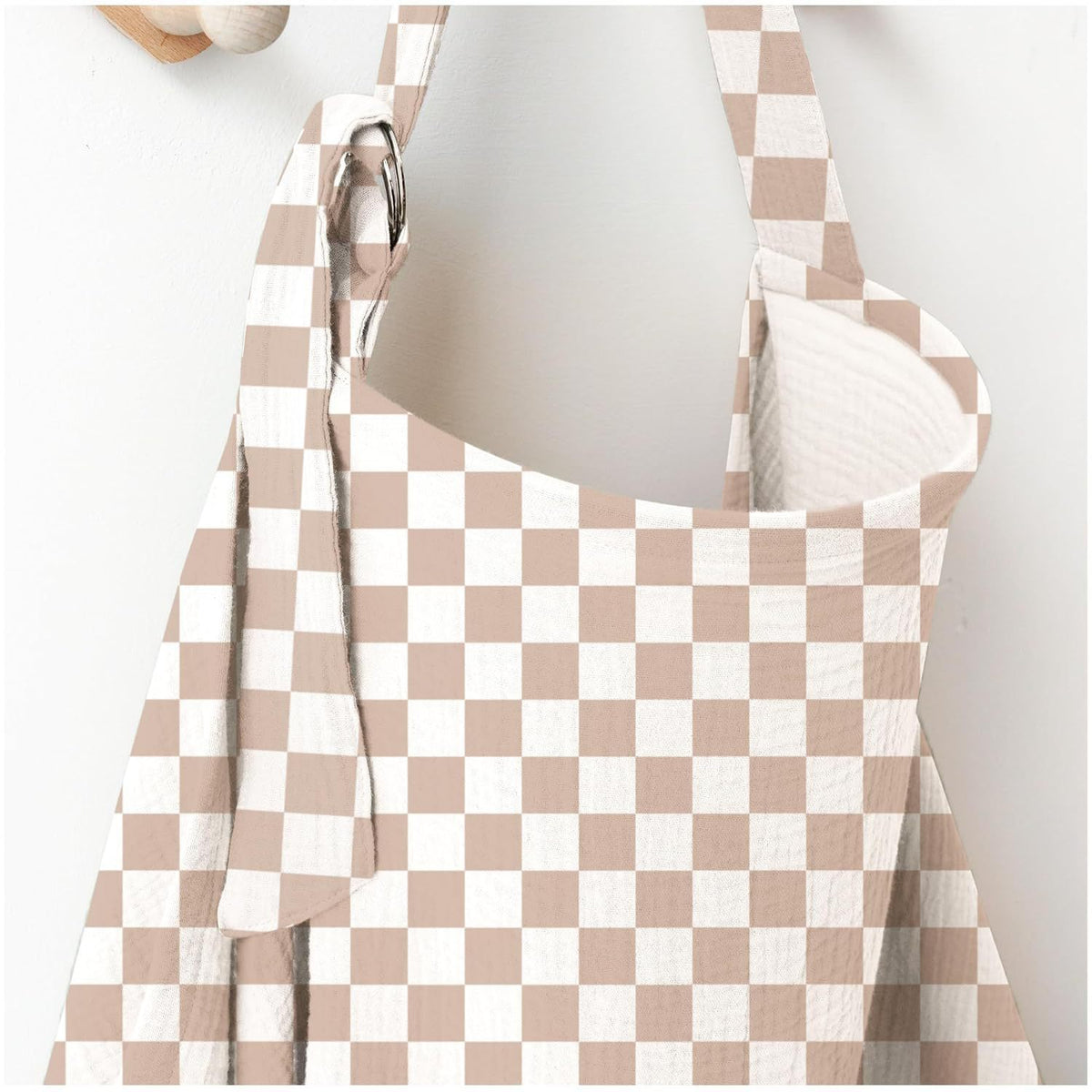 Beige and white checkered nursing cover with adjustable shoulder strap and metal ring for breastfeeding by Mama's Dream