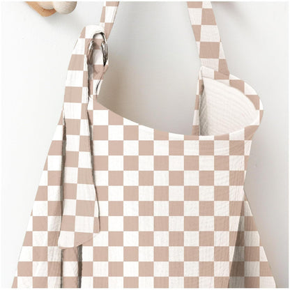 Beige and white checkered nursing cover with adjustable shoulder strap and metal ring for breastfeeding by Mama's Dream