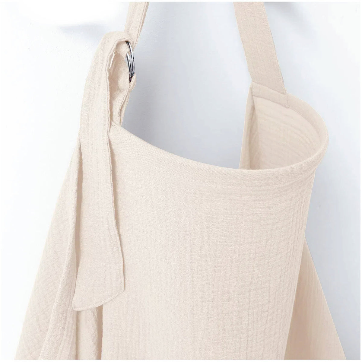 Cream nursing cover for breastfeeding with soft textured fabric and adjustable shoulder strap by Mama's Dream