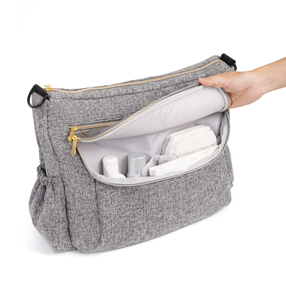 Open gray diaper bag showing organized front pockets for diapers, wipes and baby essentials by Mama's Dream