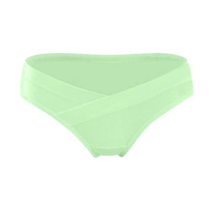 Light green maternity underwear with a crossover waistband that sits below the belly, shown on a white background by Mama's Dream