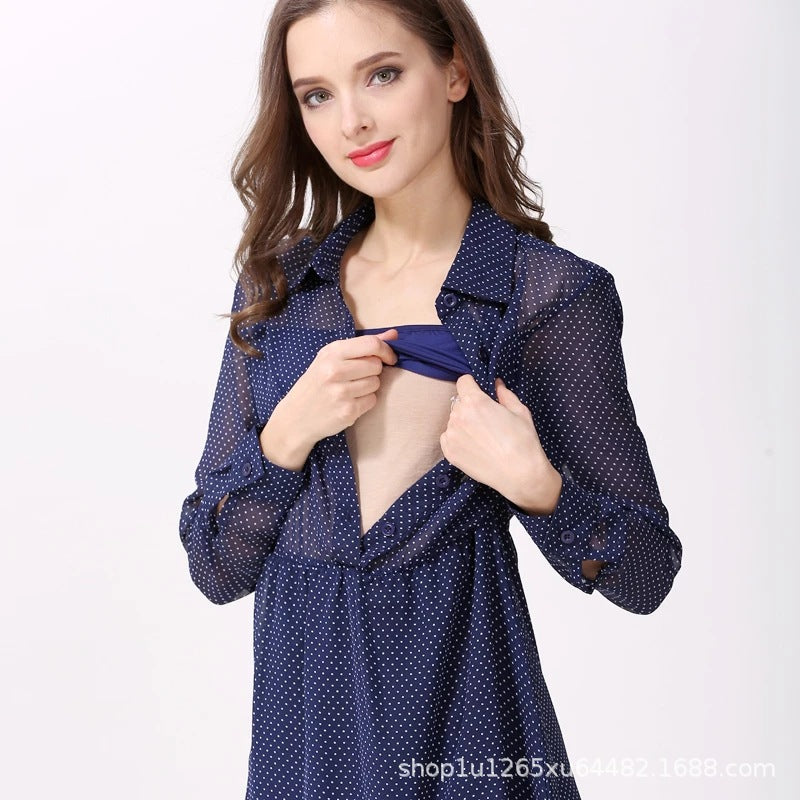 Woman demonstrating discreet breastfeeding access on a navy polka dot maternity nursing dress by Mama's Dream