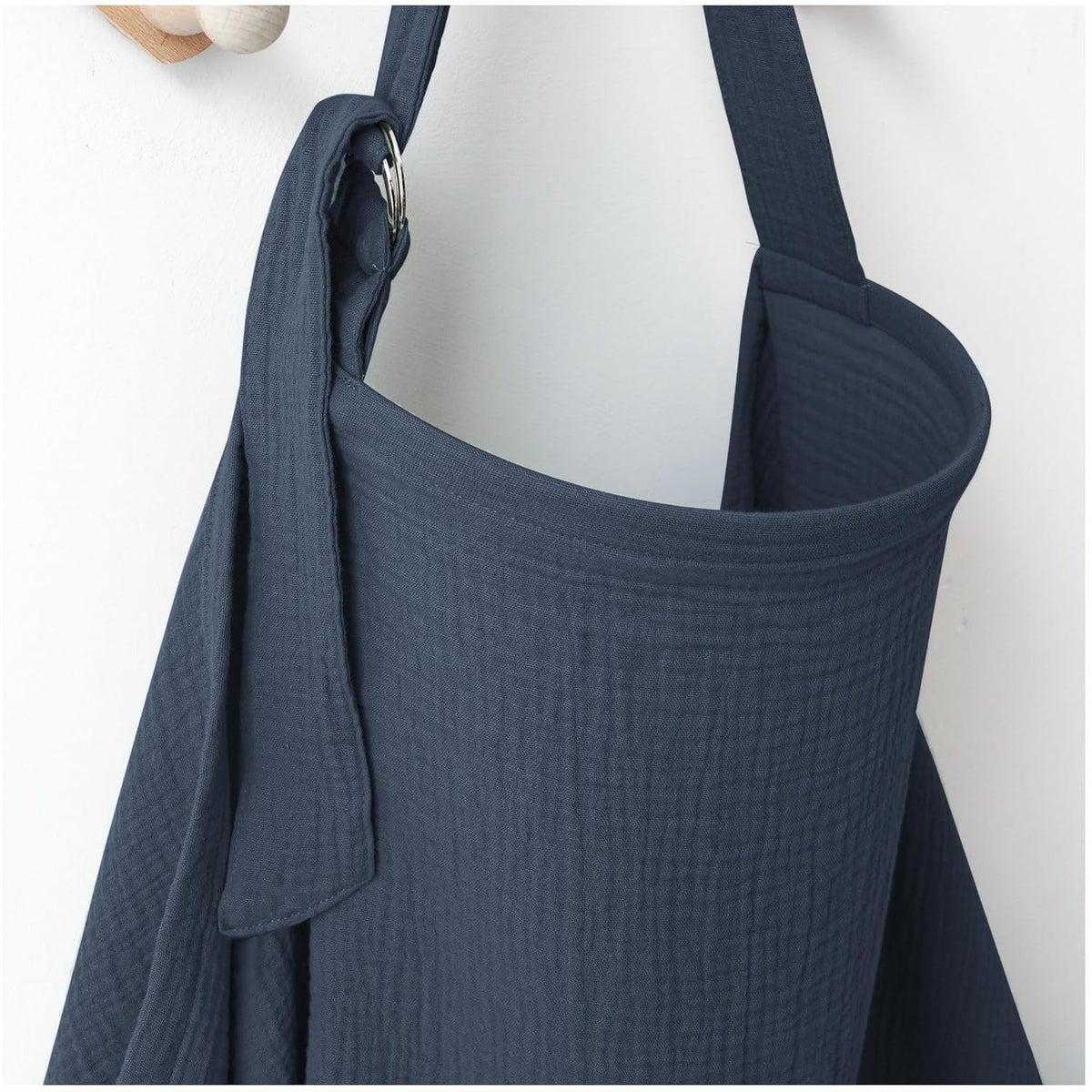Navy blue nursing cover for breastfeeding with textured fabric and adjustable shoulder strap by Mama's Dream
