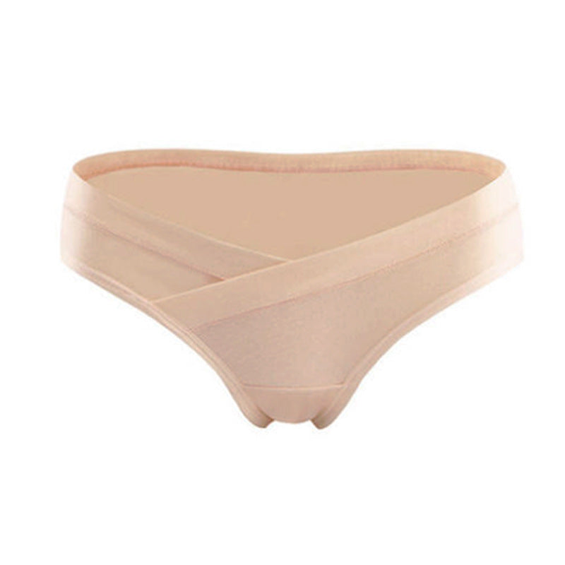 Nude maternity underwear with a crossover waistband that sits below the belly, shown on a white background by Mama's Dream