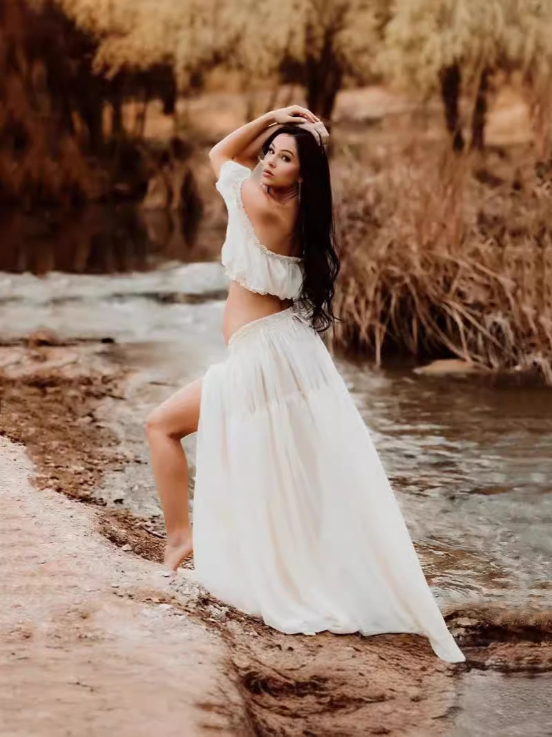 White two piece maternity photoshoot outfit with off shoulder crop top and flowing skirt for pregnancy photography by Mama's Dream